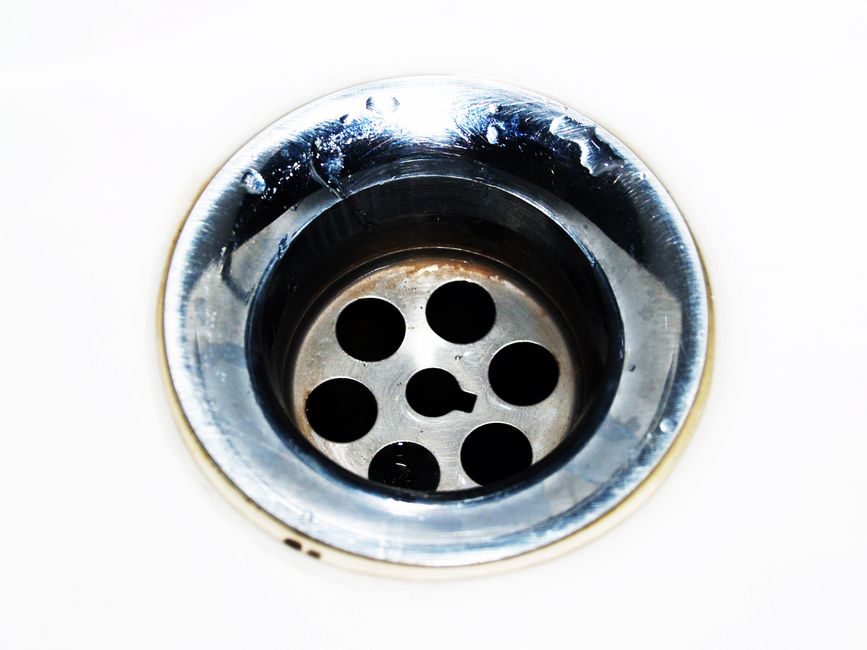 Why Sink Drains Smell and Clog: The Chemistry of What Collects in the Pipe