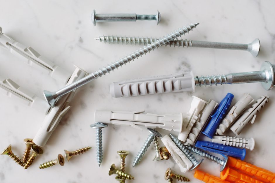 Hollow-Wall Anchors vs. Studs: What Actually Holds Interior Trim and Finish Hardware