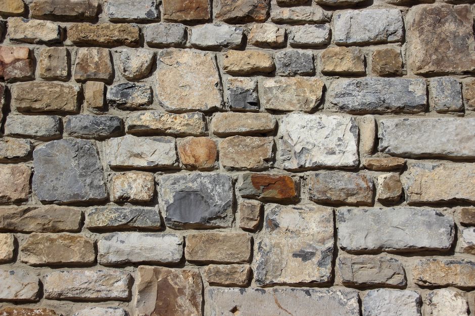 Why Retaining Walls and Hardscape Edges Fail at the Base First